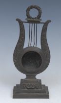 A Regency dark patinated bronze lyre shaped pocket watch stand, stepped rectangular base, 21.5cm