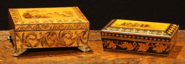 A Regency penwork sarcophagus work box, hinged cover decorated with a landscape, the sides with