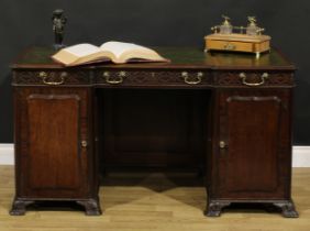 A 19th century Chippendale Revival mahogany desk, break-centre top with inset tooled and gilt