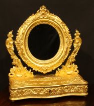 A 19th century giltwood and gesso dressing glass, oval mirror plate, serpentine base with long