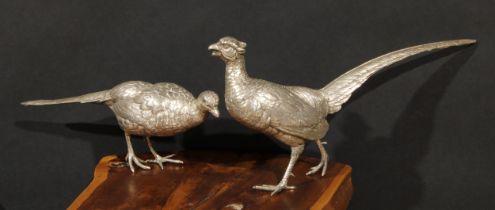 A pair of large Continental silver table decorations, as cock and hen pheasants, naturalistically