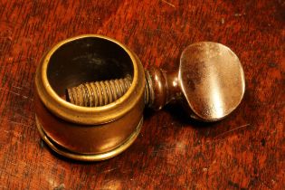 Nutcrackers - an 18th century brass screw-action pocket nutcracker, the ring shaped receptacle 3cm
