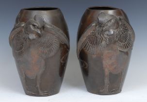 A pair of Japanese brown patinated bronze ovoid vases, cast in relief with cockerels, 26cm high,