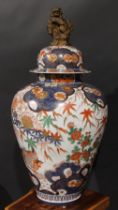 A large Japanese ovoid jar, painted in the Chinese taste in the Imari palette with phoenix and