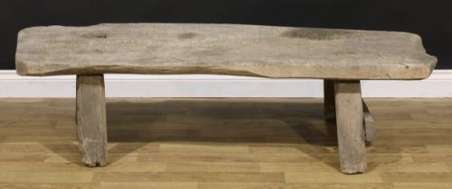 A 19th century vernacular elm pig bench, 43cm high, 153cm long, the top 44cm wide