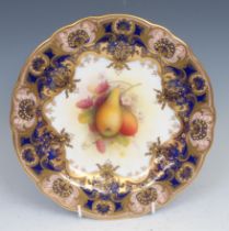 A Royal Worcester shaped circular plate, painted by Albert Shuck, signed, with ripe pears and