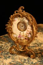 An early 20th century gilt metal mounted enamel cartouche shaped boudoir timepiece, 1.75cm
