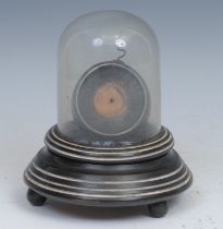 A 19th century ebonised pocket watch stand, the hinged cover with glass dome, bun feet, 16cm high,
