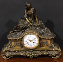 A late 19th century French dark patinated and gilt metal figural mantel clock, 10cm convex enamel