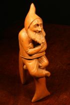 Nutcrackers - a Black Forest novelty lever-action nut cracker, carved as a gnome, full length,