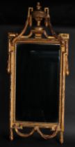 An Adam design giltwood and gesso pier glass, crested by a Neo-classical urn, rectangular mirror