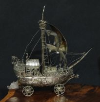 A Dutch silver nef, single mast, the hull chased with scenes from mythology, 22cm long, import