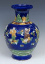 A Chinese ovoid vase, in the manner of Wang Bing Rong, decorated in tones of green, brown and yellow