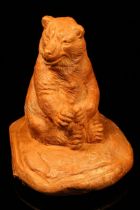 Alfred Lyndhurst Pocock (1882 - 1962), a terracotta cabinet sculpture, of a seated bear, 8cm high,