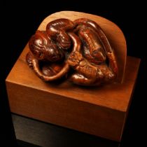Alfred Lyndhurst Pocock (1882 - 1962), a burr wood carving, of a tiger grappling with a snake, 8.5cm