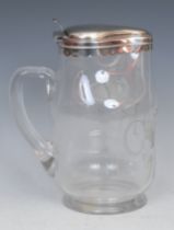 A Victorian silver mounted beer jug, after a Charles I Civil War period Royalist leather jack,