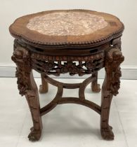 A Chinese hardwood fish bowl stand or table, shaped circular top with inset soapstone panel, above a