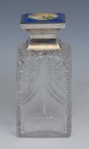 A George V silver and guilloche enamel mounted square hobnail-cut glass perfume bottle, hinged cover