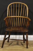 A 19th century ash and elm Windsor elbow chair, hoop back, 89cm high, 55cm wide, the seat 39.5cm