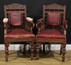 A pair Anglo-Indian hardwood armchairs, carved throughout with scrolls, flowers and typical