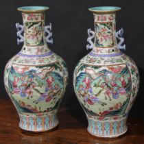 A pair of Chinese famille rose ovoid vases, painted in the typical Cantonese taste with warriors