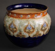 An Art Nouveau Royal Doulton stoneware jardiniere, by Rose Collins, flocculated cobalt blue ground