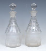 A pair of 19th century mallet shaped decanters, each with three neck rings above a faceted
