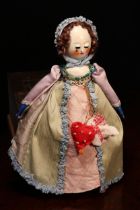 A reproduction 'Queen Anne' style carved and painted wooden artist doll, the carved and painted head