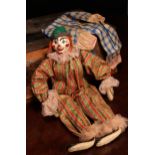 A novelty carved and painted wooden head doll, in the form of a Clown, the carved and painted wooden