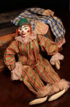 A novelty carved and painted wooden head doll, in the form of a Clown, the carved and painted wooden