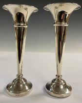 A pair of Elizabeth II silver trumpet shaped specimen vases, Birmingham 1957 - 59