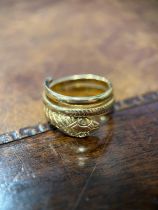 A gold coloured metal snake ring, engraved with chevrons forming the snakes skin, probably 9ct gold,