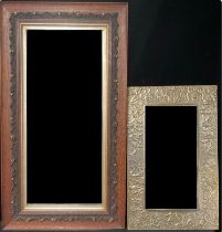 An Arts and Crafts pewter framed mirror; an oak framed bevel glass mirror (2)