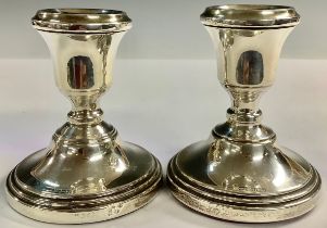 A pair of hallmarked silver candlesticks