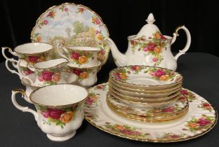 A Royal Albert Old Country Roses pattern teapot, five teacups and saucers, three tea plates, milk
