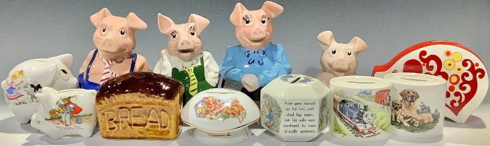 A set of four Nat West Piggy Banks; others money boxes, Wedgwood Peter Rabbit and Thomas The Tank