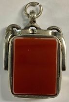 A hallmarked silver bloodstone and carnelian swivel Albert fob