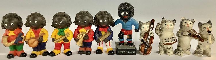 A Robertson's Golly footballer; a similar five piece band; a four piece cat band