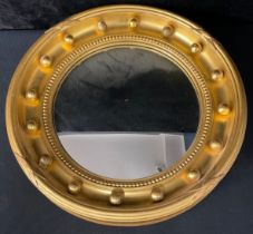 A Regency style giltwood circular convex wall mirror, 45cm diameter