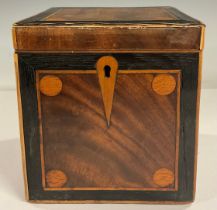 A GIII cube tea caddy, the hinged cover front and sides inlaid with boxwood roundels within ebony