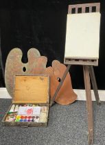 A mahogany artist's palette, C Roberson & Co, 71 Parkway, London, Eng, 43cm high; two others larger;