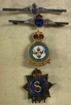 Three enamel RAF badges; a silver and enamel badge