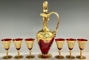 ***LOT WITHDRAWN****A Murano ruby glass decanter and six wine glasses, gilded and painted with