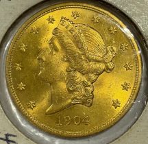 Coins - an American gold $20 coin, eagle and crest, 1904