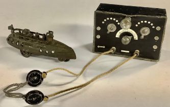 A miniature dolls house radio set; headpones; a Penny Toys Battleship