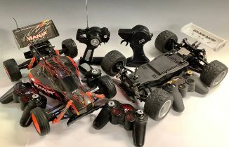 A radio control ManXX race car, another; other controllers qty
