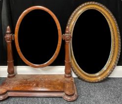 A large dressing mirror; an oval framed wall mirror (2)