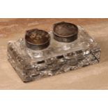 A George V silver mounted twin-section desk inkwell, hinged covers, hobnail-cut base, 11.5cm wide,