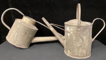 A galvanized one gallon watering can; another similar (2)