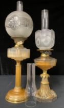 A 19th century brass and moulded glass oil lamp, on stepped circular base, the reeded stem